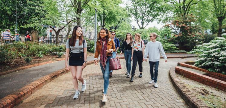 Students walking past the School of Music