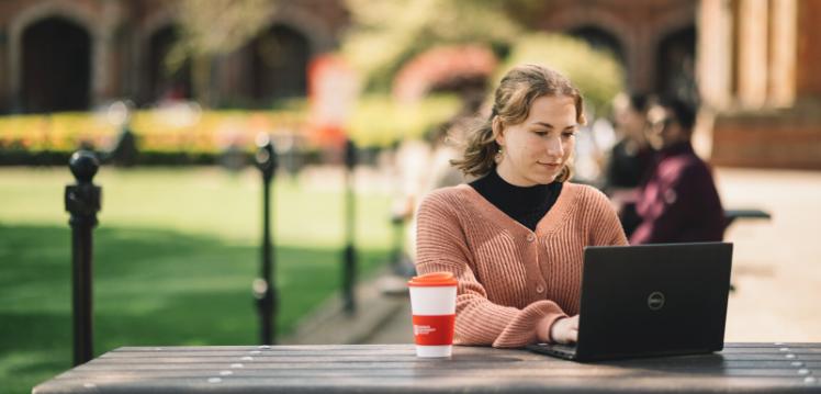 Student studying in the Quad