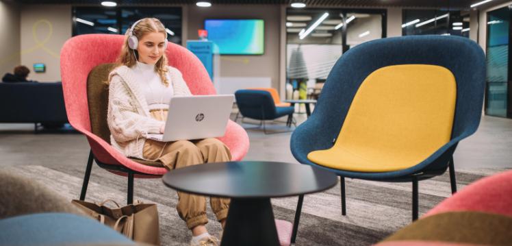 Student on laptop in One Elmwood building