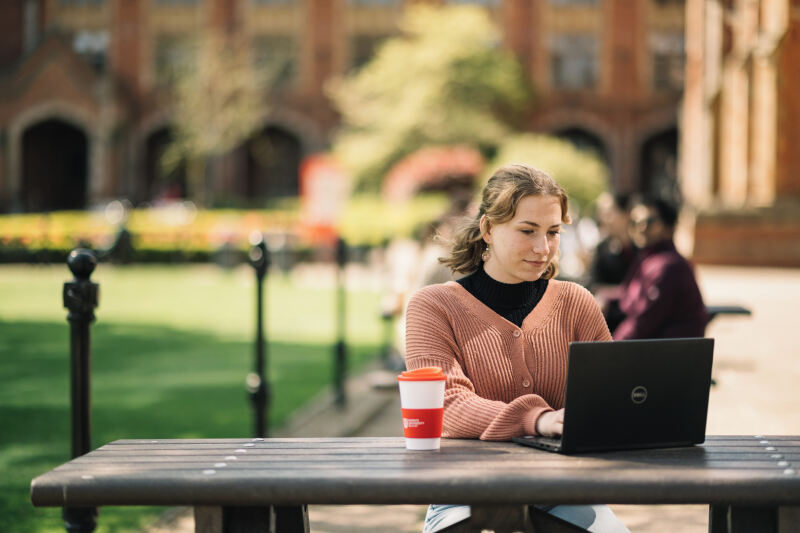 Student on laptop in the Quad