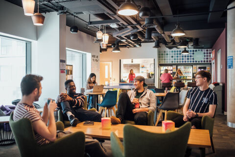 Students socialising in the common lounge in Elms BT1