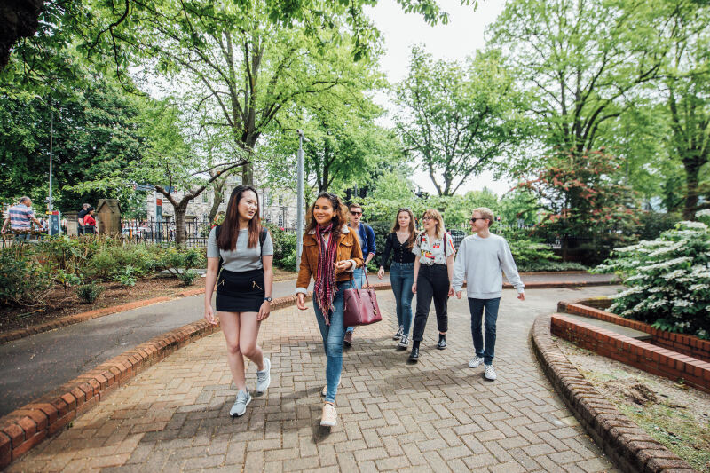 Students walking past the School of Music