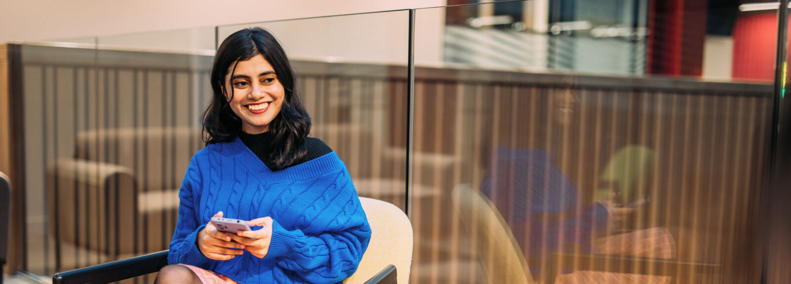 Indian student sitting in One Elmwood building