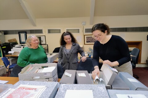 Lynda Walker discussing her collection at Linen Hall with two students