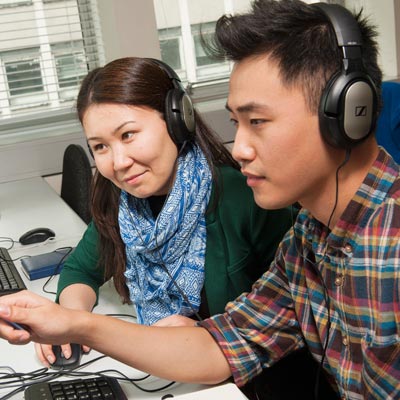 international students wearing headphones