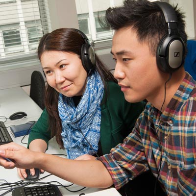 international students wearing headphones