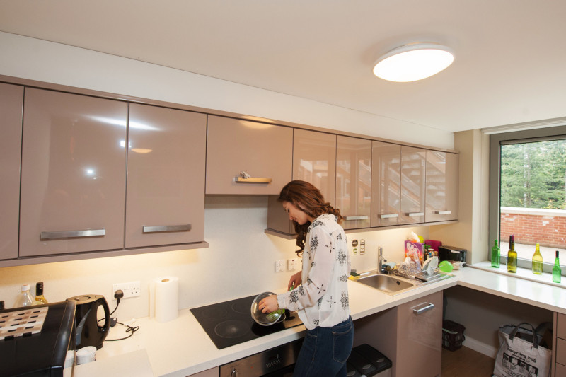 a student cooking in the kitchen of a Willow walk student accommodation