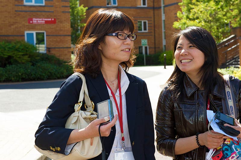 two international students heading from Elm's Village to class