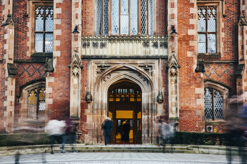 Main entrance to the lanyon building with students walking in and out