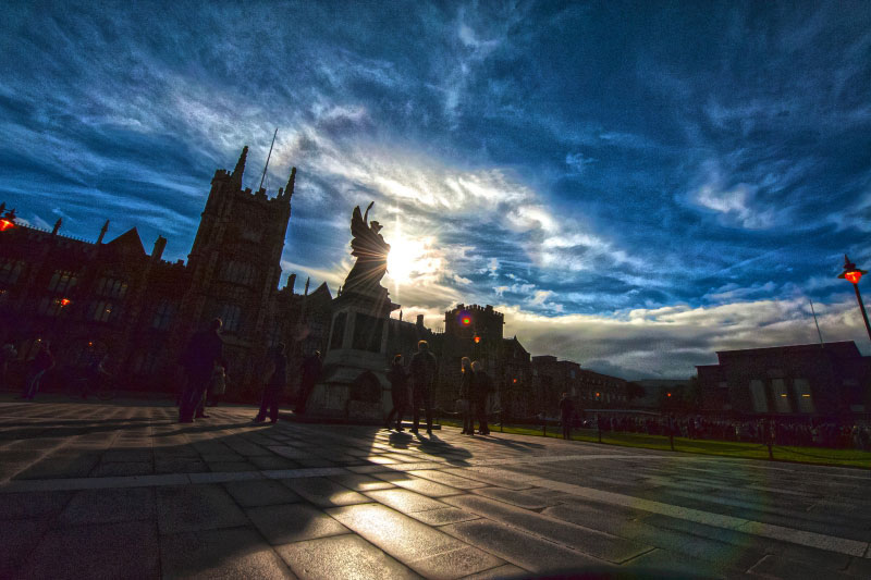 Low shot of lanyon building and war memorial with bright blue sky