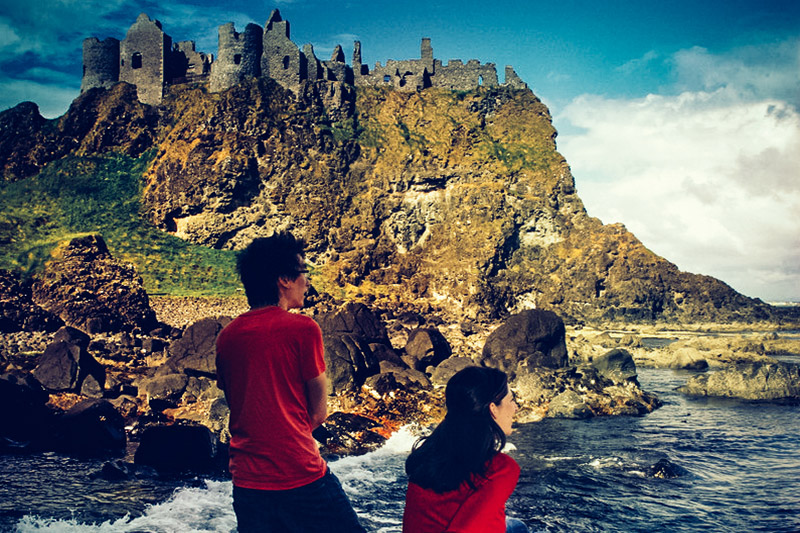 800-dunluce castle with people