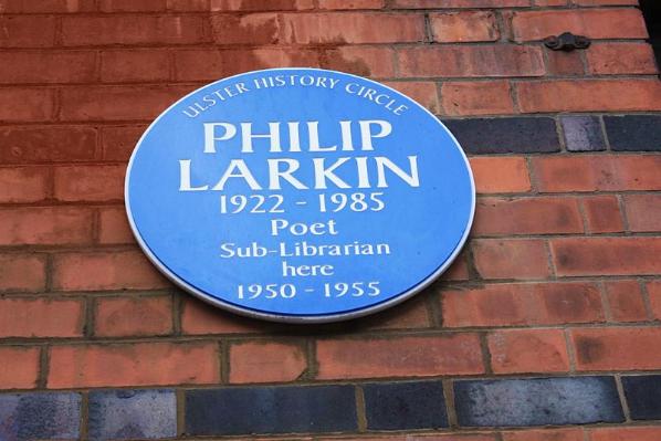 Ulster history circle plaque commemorating the poet, Philip Larkin, on the exterior wall of the Graduate School