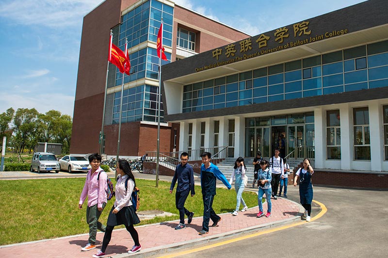 students walking through the campus of China Medical University – Queen’s Joint College