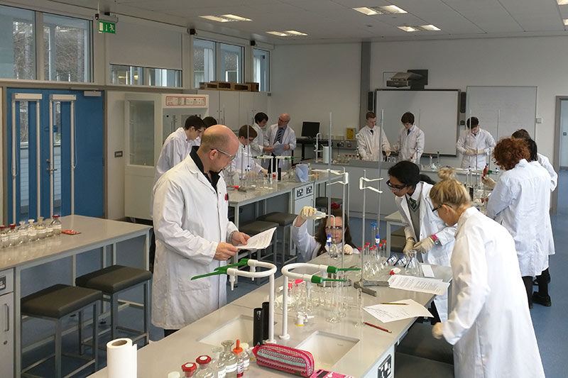 Students and staff working in a chemistry laboratory