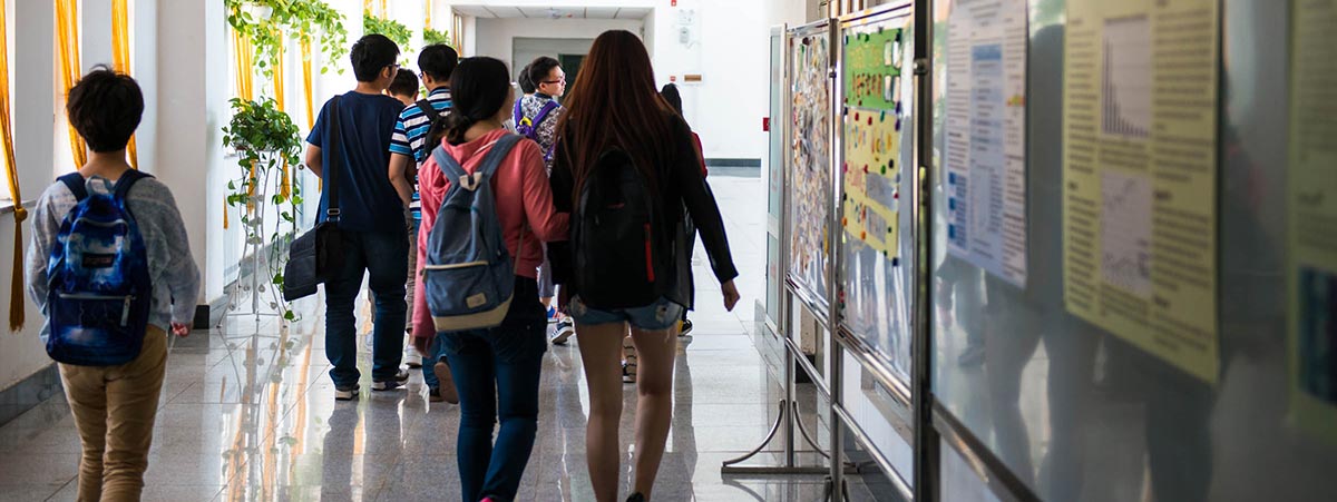 students walking through the CQC halls