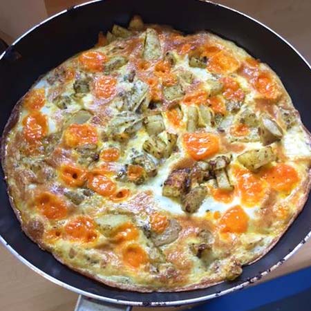 Spanish omelette with tomatoes and potatoes