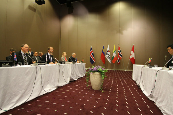 Officials at their seats in a meeting