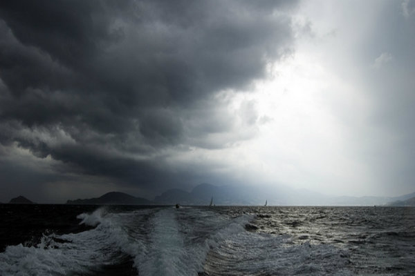 Large clouds looming over the ocean