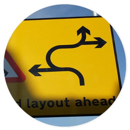 Confusing road sign showing diversions ahead