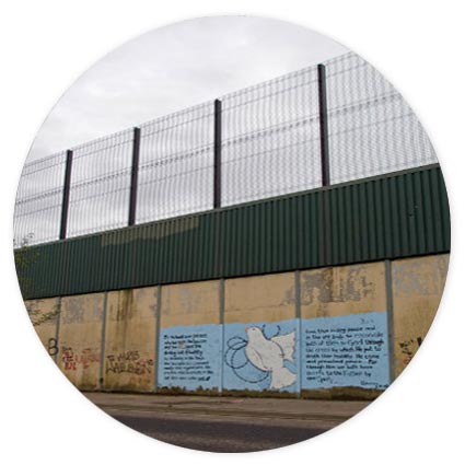 Peace wall in Belfast with painting of a dove on it