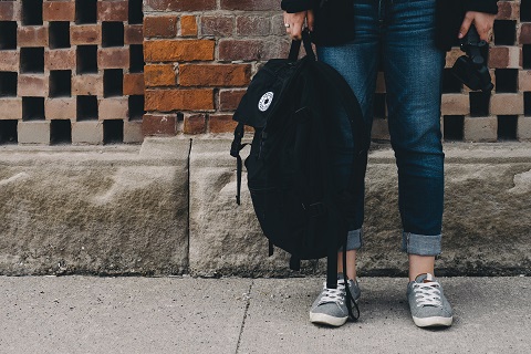 student with backpack