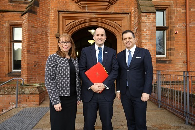 Professor Nola Hewitt-Dundas, Head of Queen's University Management School; Jake Barry MP; and Glyn Roberts, CEO of Retail NI