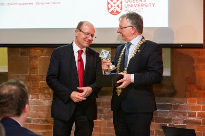 Mr Peter Quinn, President of Engineers Ireland, presenting Mr Kirkland with the Sir Bernard Crossland 'Qube' made by the Faculty of Engineering and Physical Sciences at Queen's University Belfast