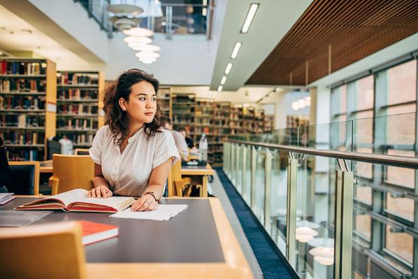 A Student seated in The McClay Library