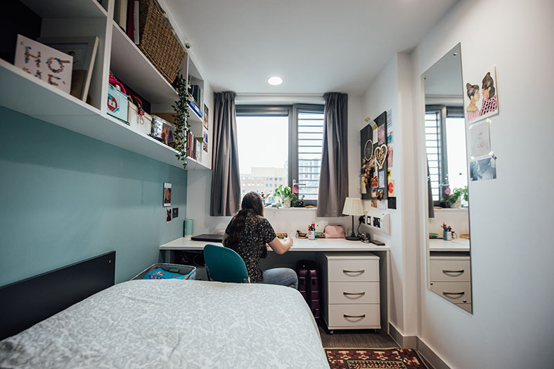 Female student in bedroom