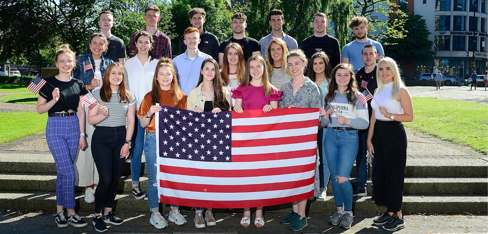 Students holding an American flag
