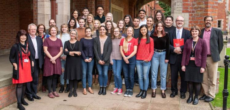 George Washington university students and Queen's staff