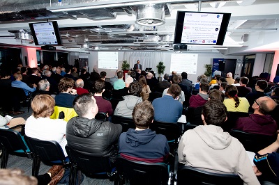 Professor Alain Aspect presenting to a capacity audience in the Computer Science Building at Queen's University Belfast for the 2019 John Bell Day Lecture.