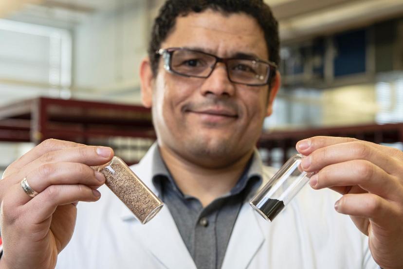 Dr Ahmed Osman with samples of spent grain, which have been identified as a novel source of carbon for various fuels.