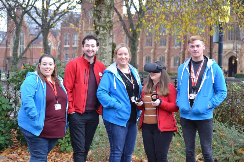 Five students standing in front of Queen's