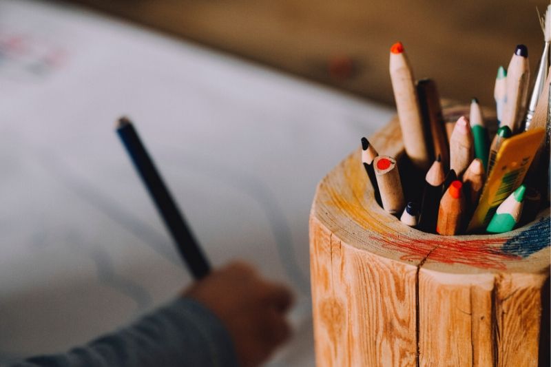 Wooden jar of colouring pencils