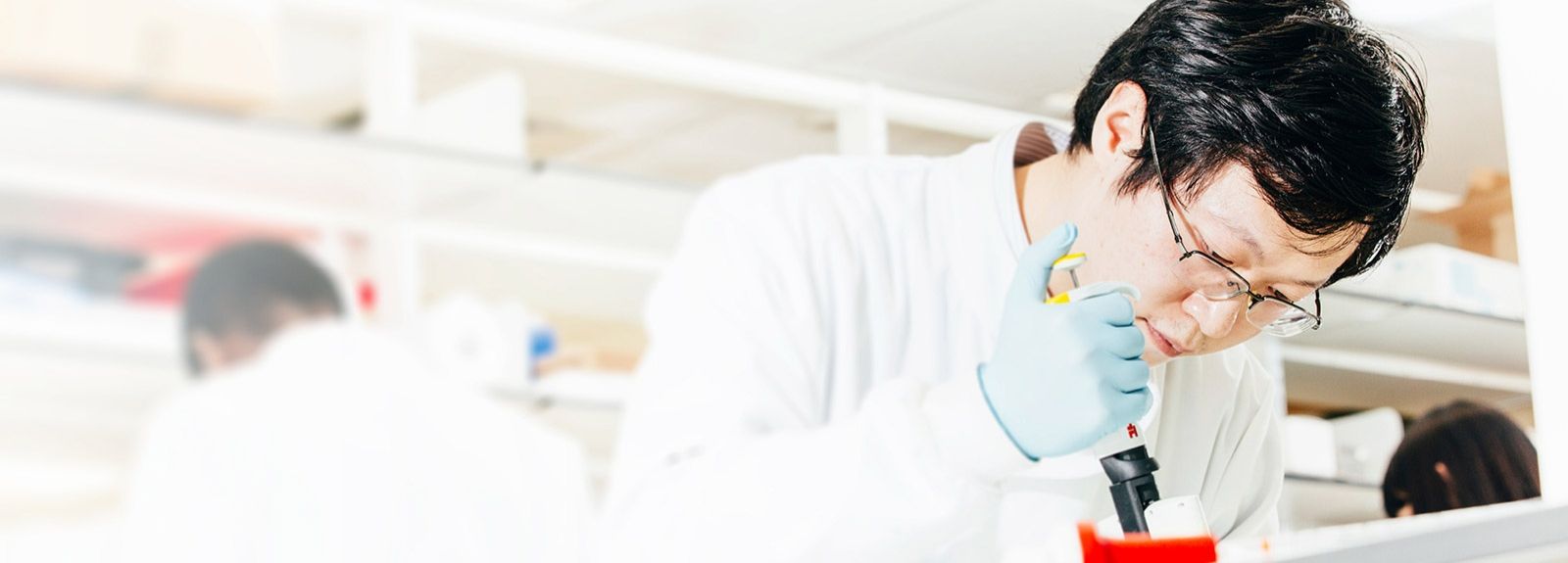 Scientist using a pipette