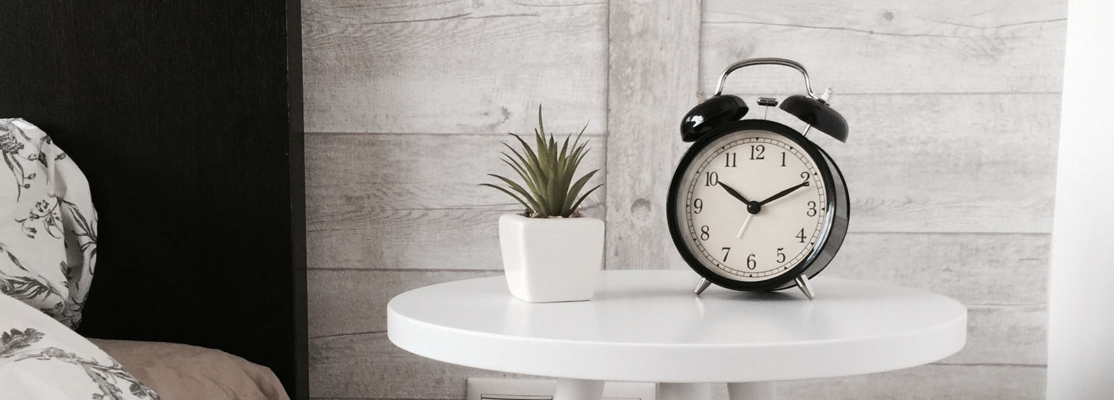 Alarm clock on a bedside table