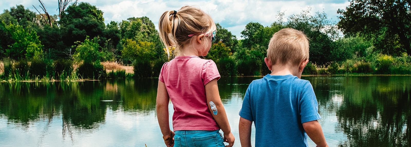 2 children near a lake