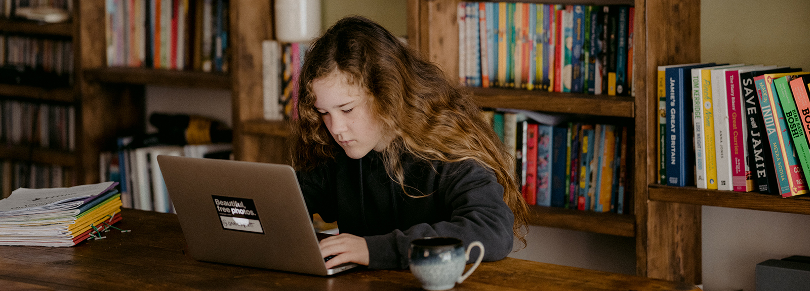 Teenager learning on a laptop