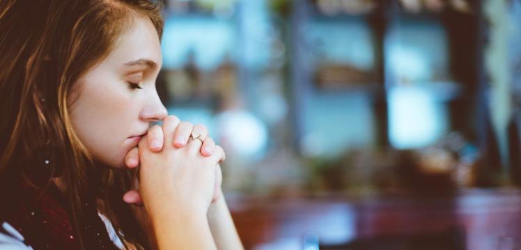 Lady at prayer