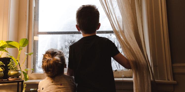 Children looking out a window