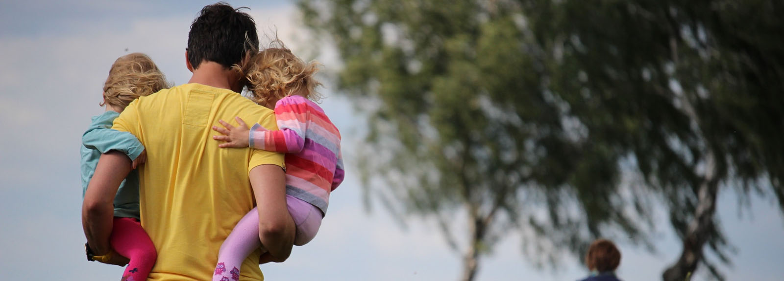 Father carrying children