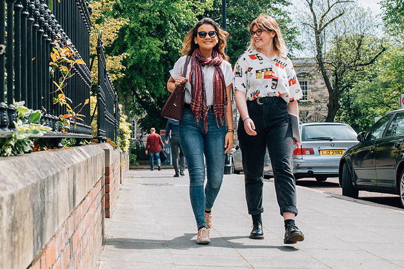 Rhea and Emma walking on University Street