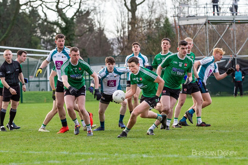 Group of GAA players chase the ball