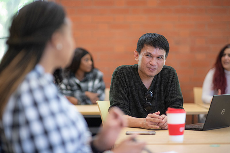 Sukirman talking with Nkem