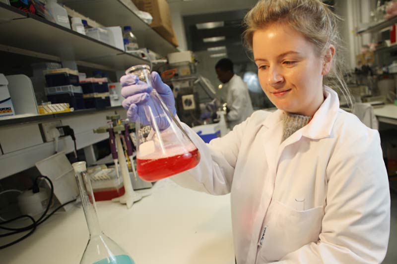 Karla O'Neill with a pyrex beaker