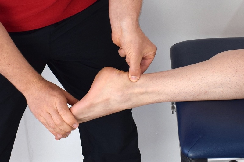 Person checking an achilles tendon