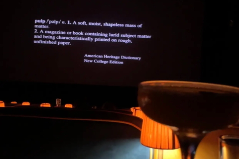 Espresso martini cocktail in front of cinema screen
