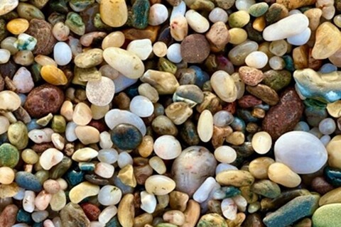 Coloured pebbles on beach