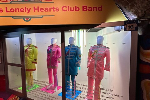 Beatles costumes on mannequins in museum